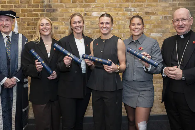 Group photo of Prof Anthony McClaran, Abi Burton, Rosie Galligan, Ellie Kildunne, Jess Breach, Bishop Richard Moth