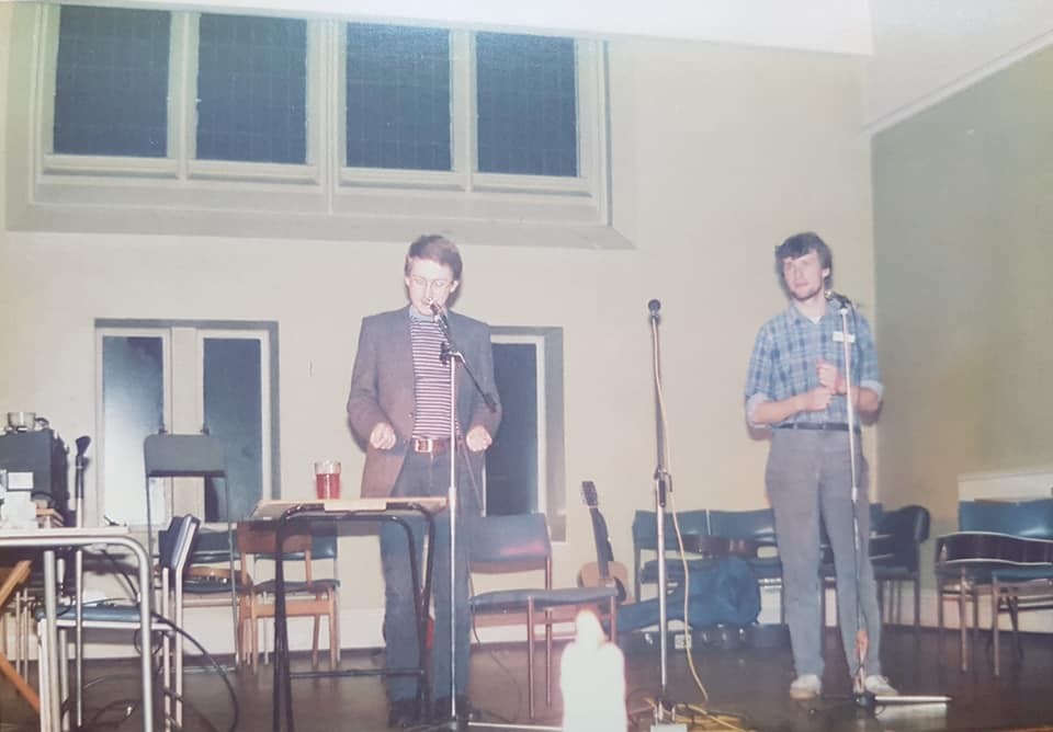 Michael Gardiner and Mick Truman on stage at, presumably, the January 1984 religious studies department social.