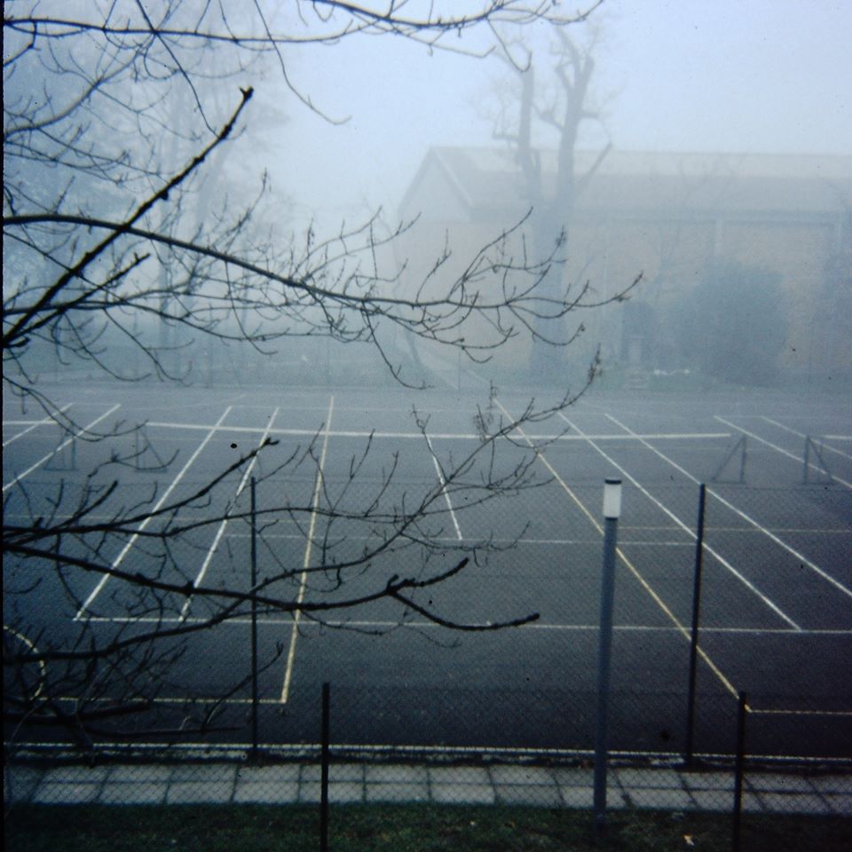 Tennis courts in fog