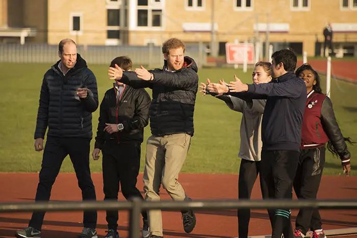 Prince William, Prince Harry and the Duchess of Cambridge on the running track