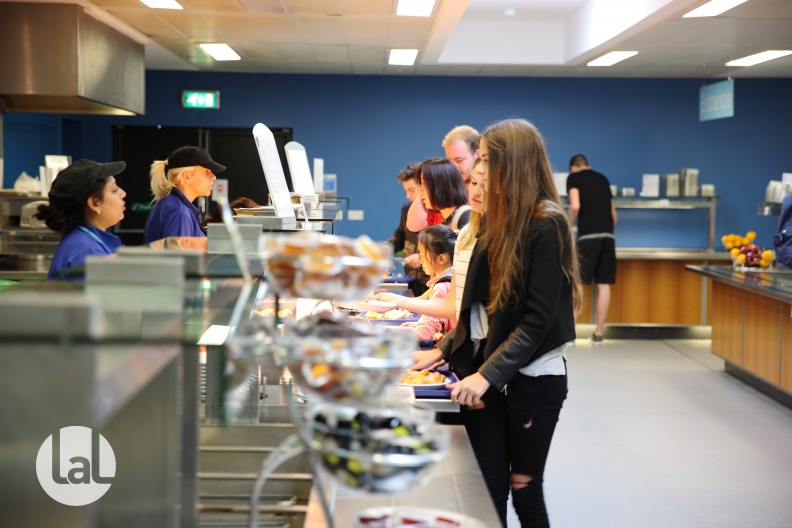Students getting dinner in the refectory