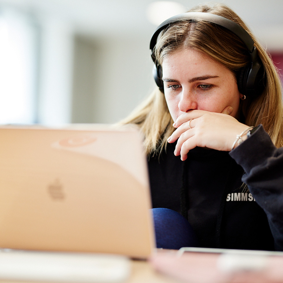 Student studying in front of a laptop.