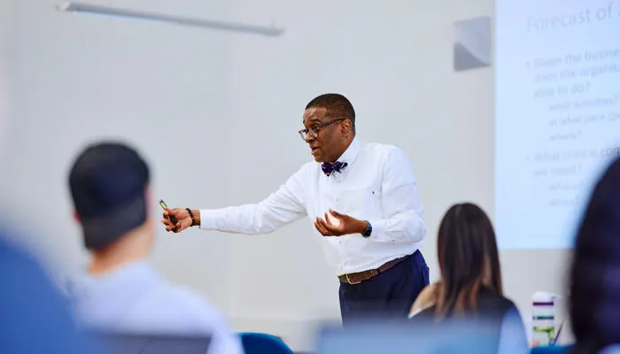 Kofi business lecturer teaching