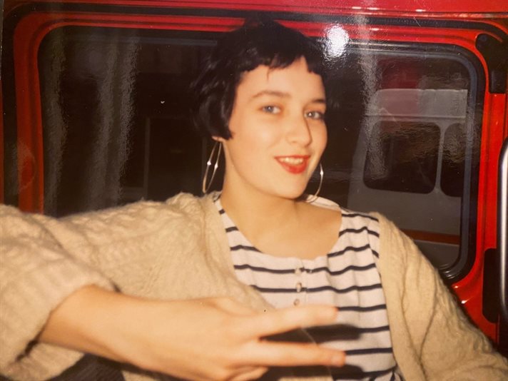 Student posing inside a bus