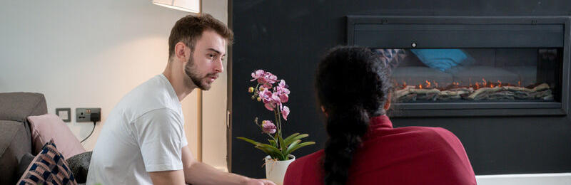 Two students talking to one another.