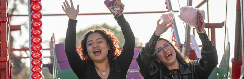 Two students enjoying a ride at the Summer Ball