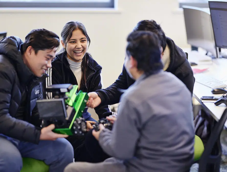 Computer Science students working with robotics