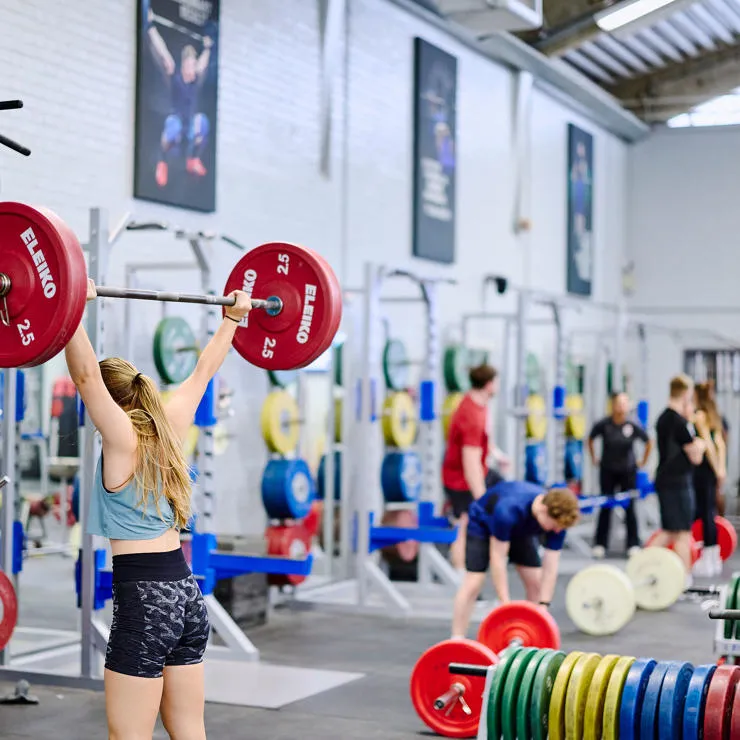 female sports student lifting