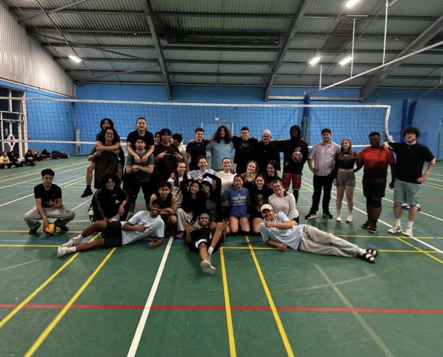 A group of students having fun in the sports hall at St Mary's University London.