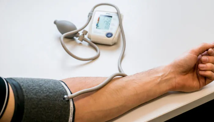Person using blood pressure monitor