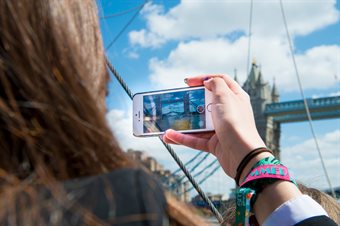 Student taking photo of Tower Bridge