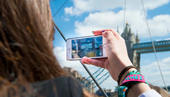 Person taking a picture of London Bridge