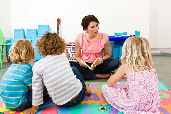 Teacher reading to children