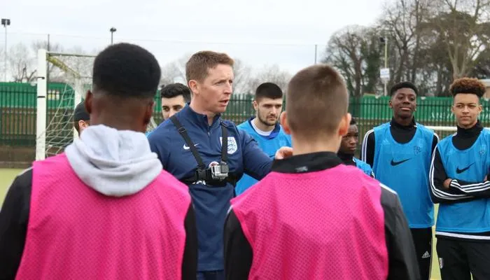 Football coach with a team