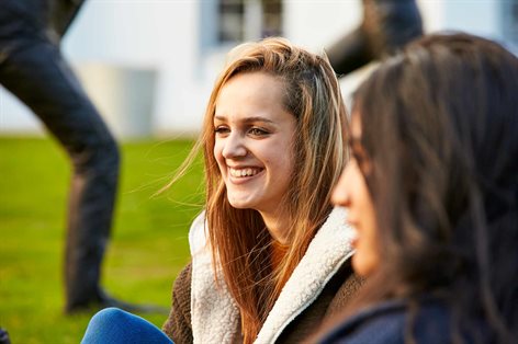 Student talking to friends on campus