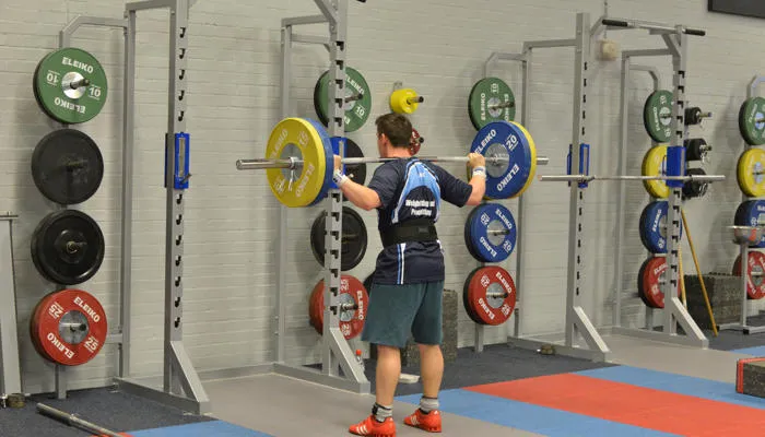 Man lifting weights in the gym