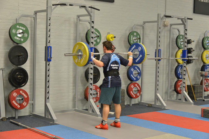 Man lifting weights in the gym