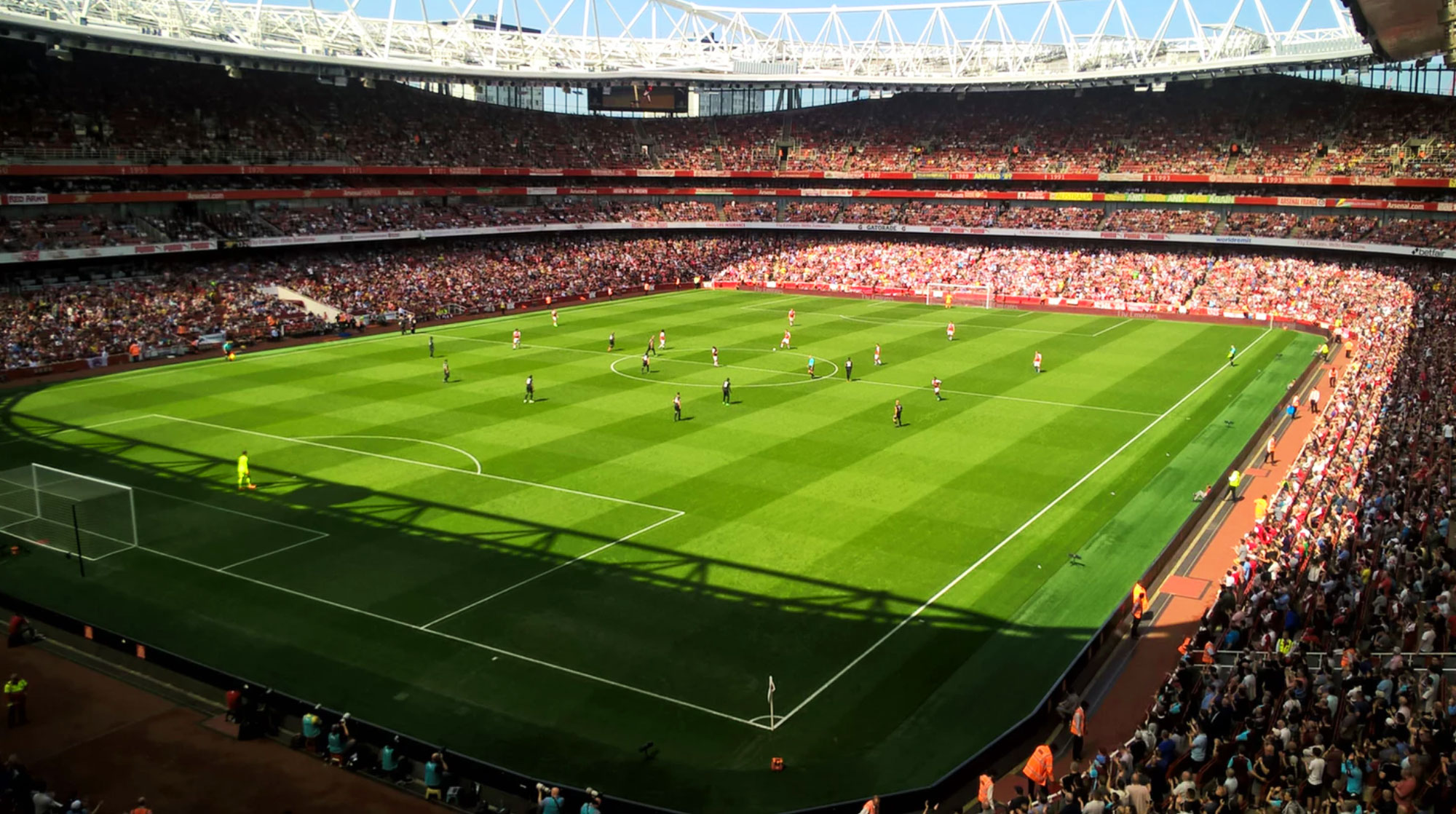 People playing football in a stadium