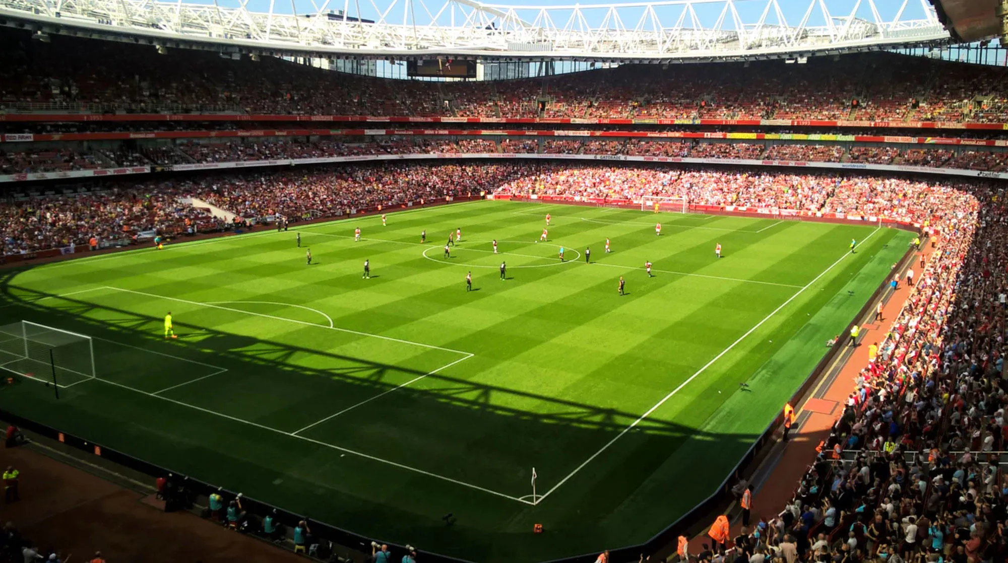 People playing football in a stadium