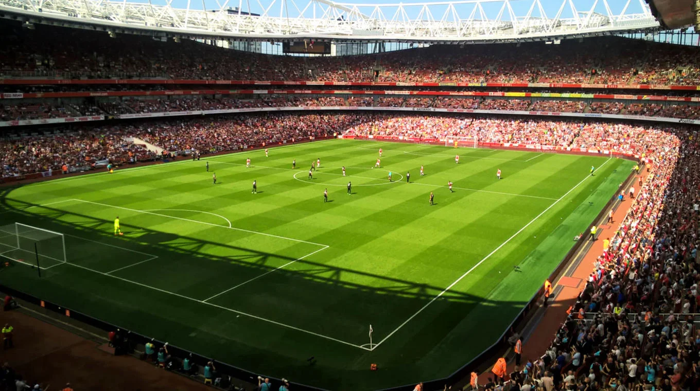 People playing football in a stadium