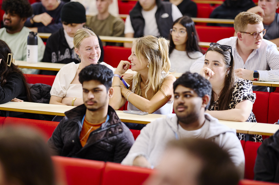 Sports degree students listening to a lesson in a lecture theatre.