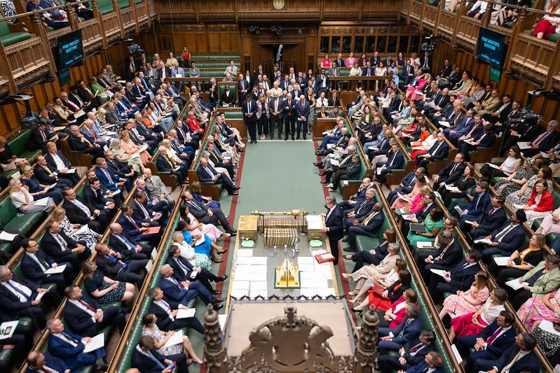 The House of Commons chamber full of MPs during a debate, viewed from above the Speaker's chair.