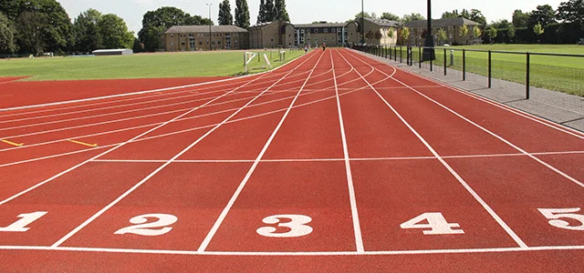 A running track on an athletics field. Lanes 1-5 can be seen.
