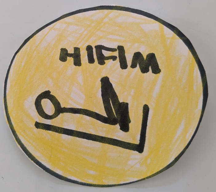 drawing of yellow disc with black border with a stick figure using a jump sled beneath the letter h i f i m