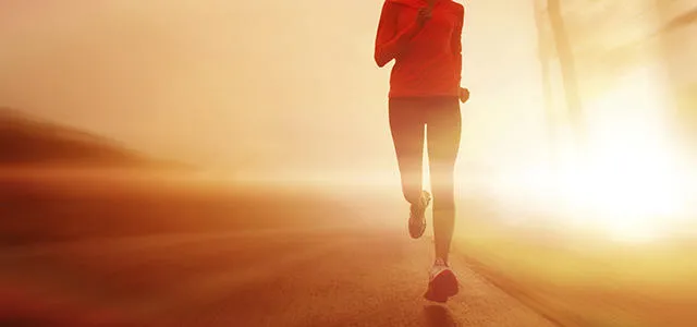 Man running at sunset.