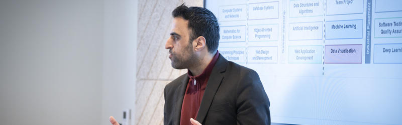 A lecturer speaking at an Open Day.