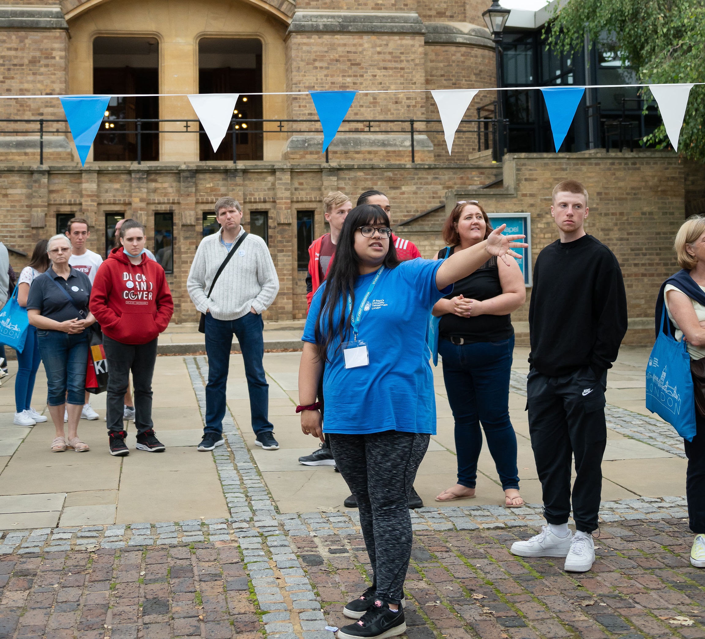 A Student Ambassador talks to prospective students on an open day.