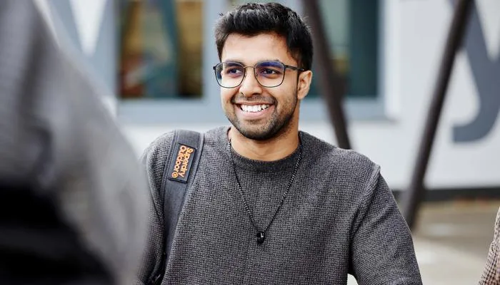 Student talking to friends outside