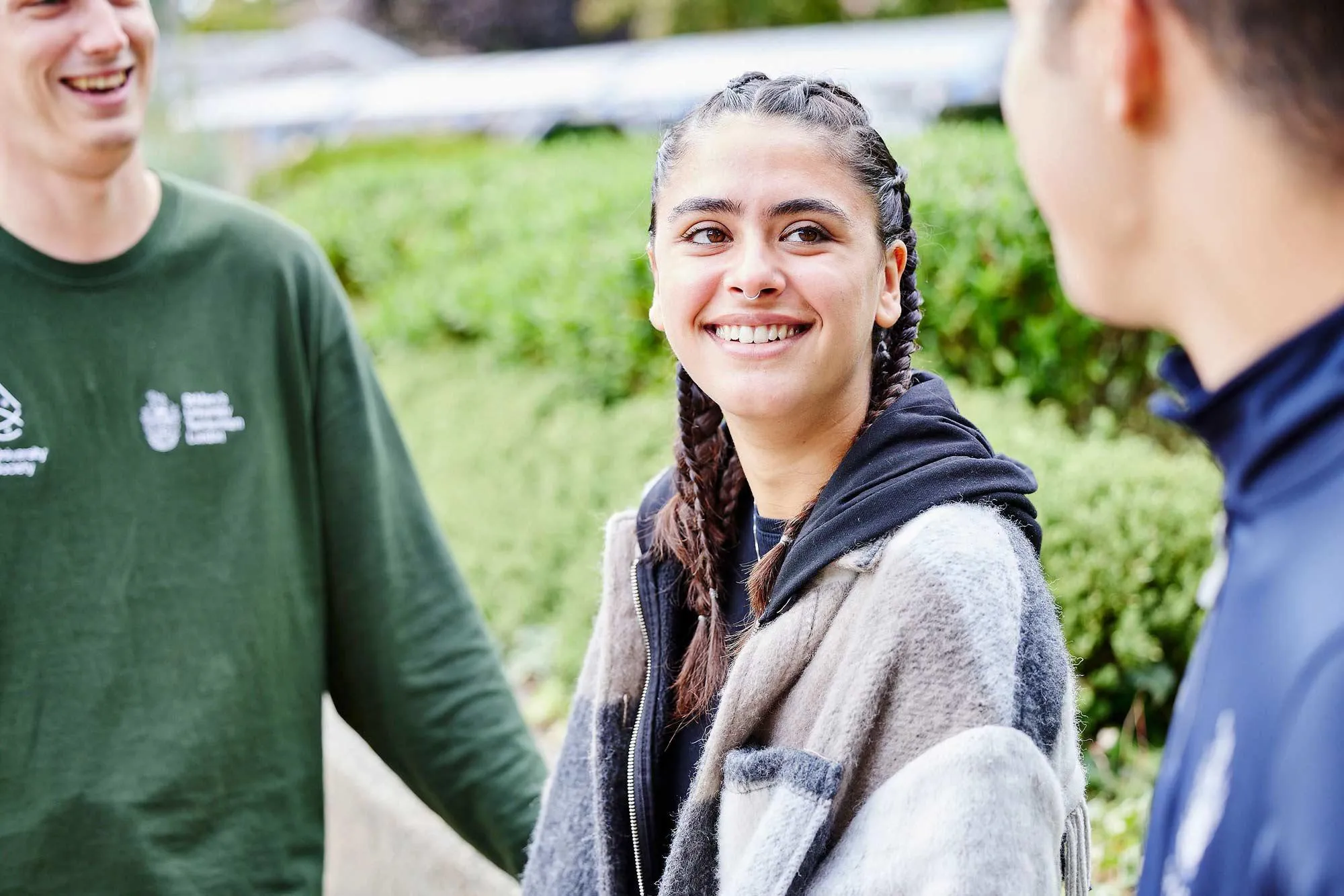 Student talking to friends outside St Mary's University London.