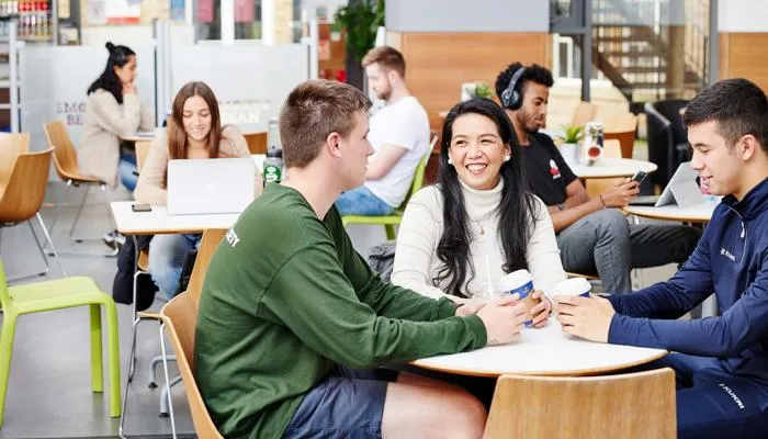 Students talking with coffee