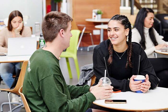 Students talking with coffee