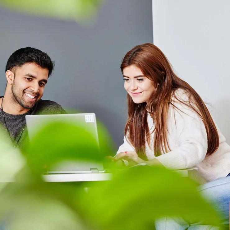 Students working together on a laptop
