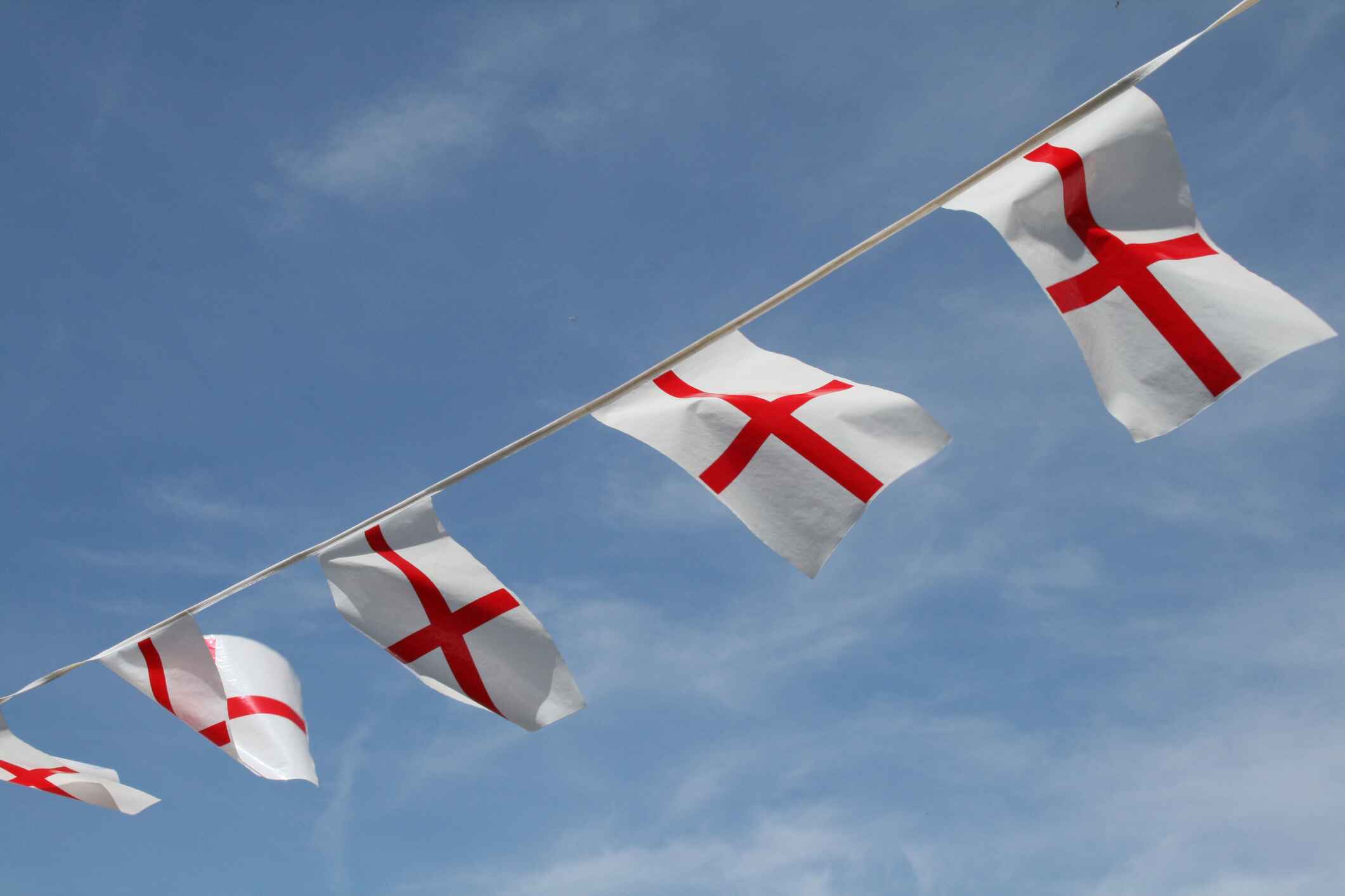 St George's flag bunting across a blue sky on St George's Day.