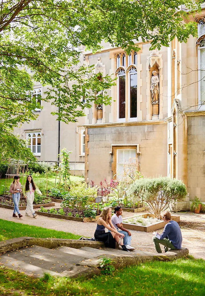 St Mary's students sitting outside Waldegrave house in sunshine