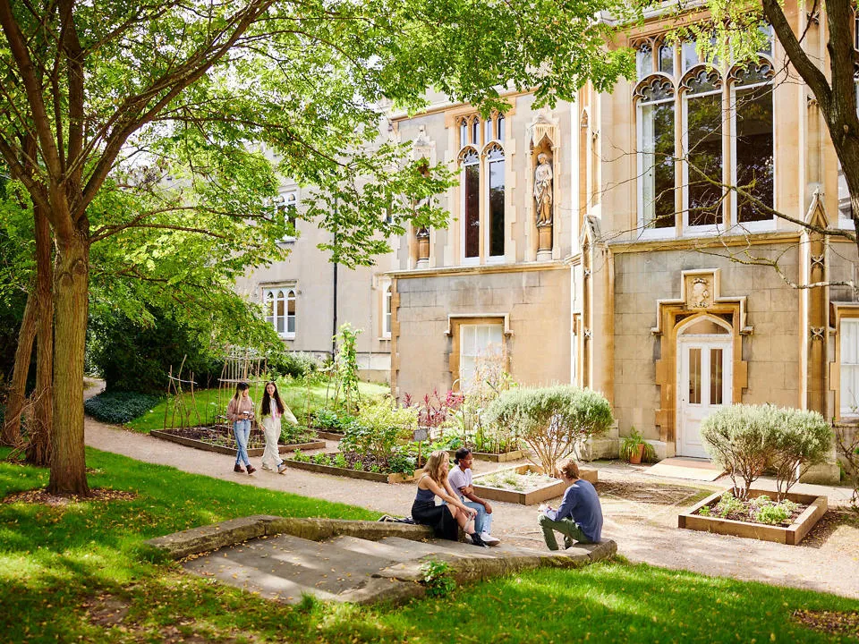 St Mary's students sitting outside Waldegrave house in sunshine