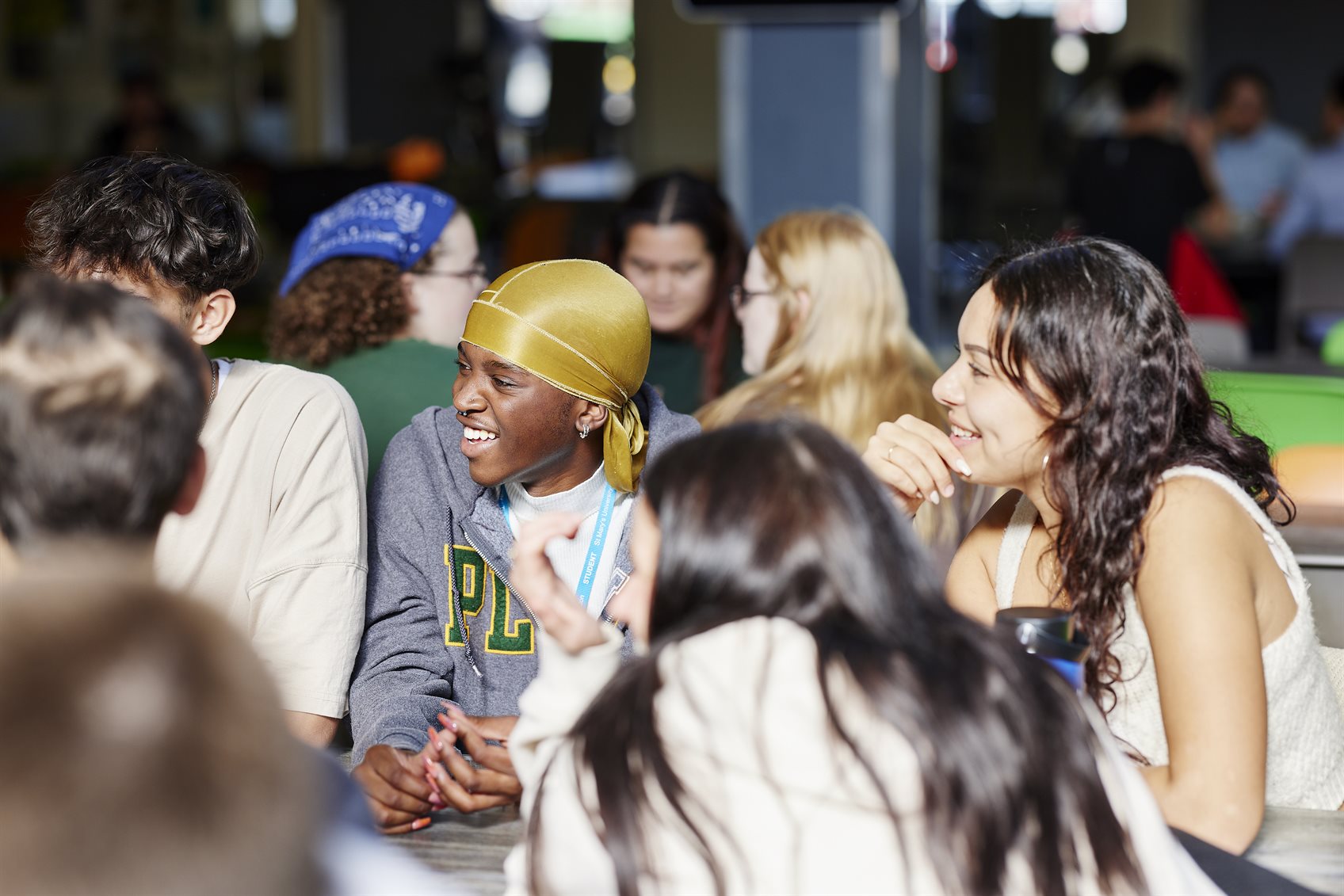 Students laughing and chatting, making the most of university life at St Mary's.