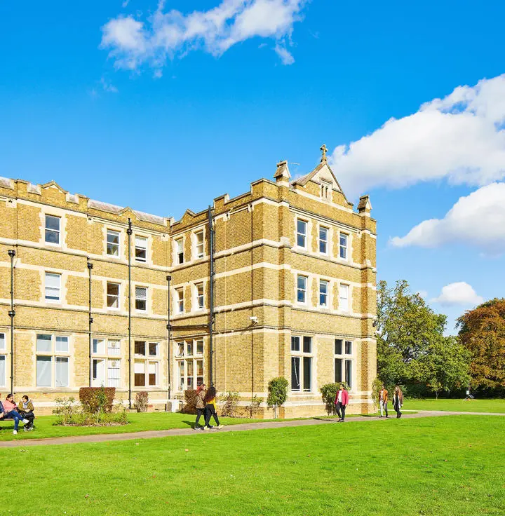 campus building with students in front