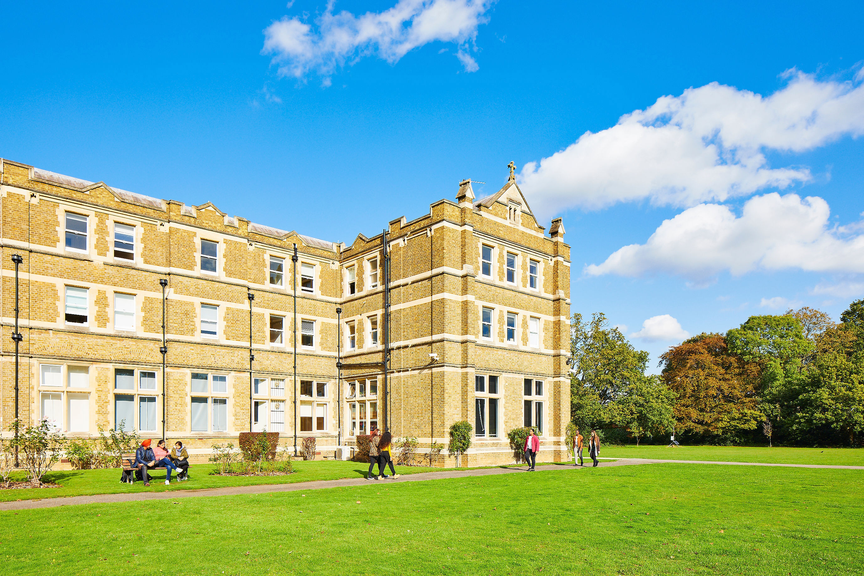 campus building with students in front