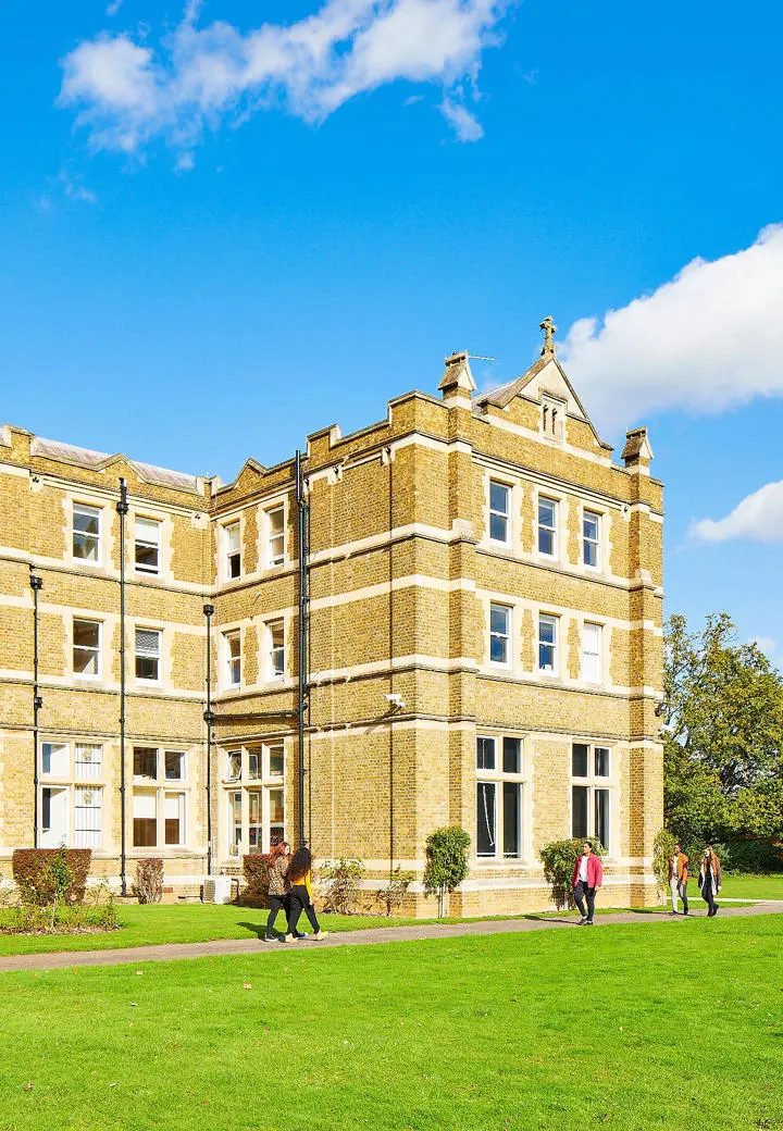 campus building with students in front