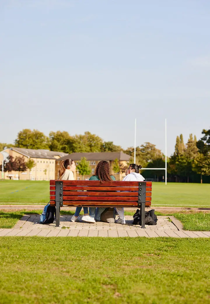 students on bench chatting