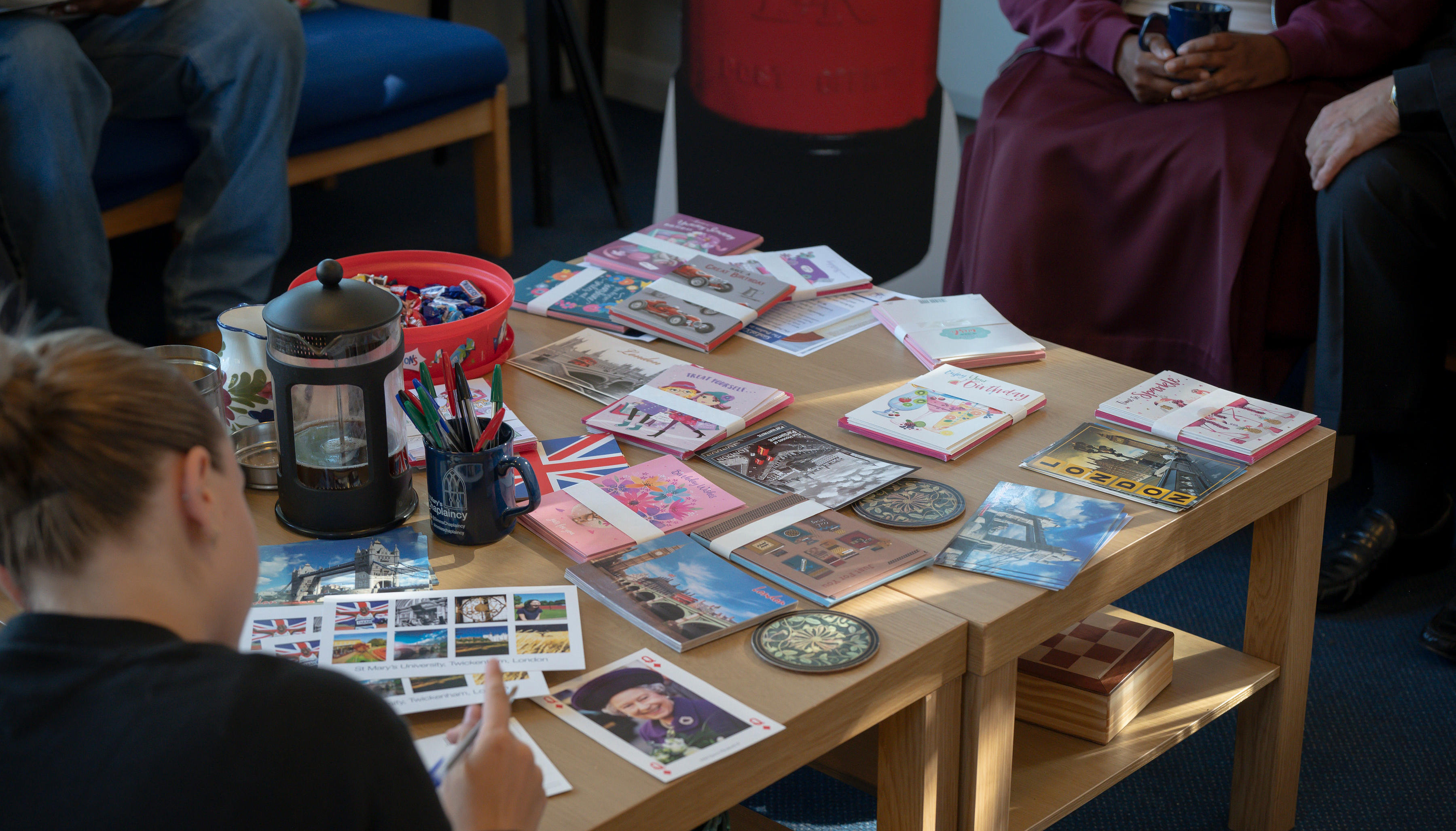 welcome week send a postcard writing postcard on desk