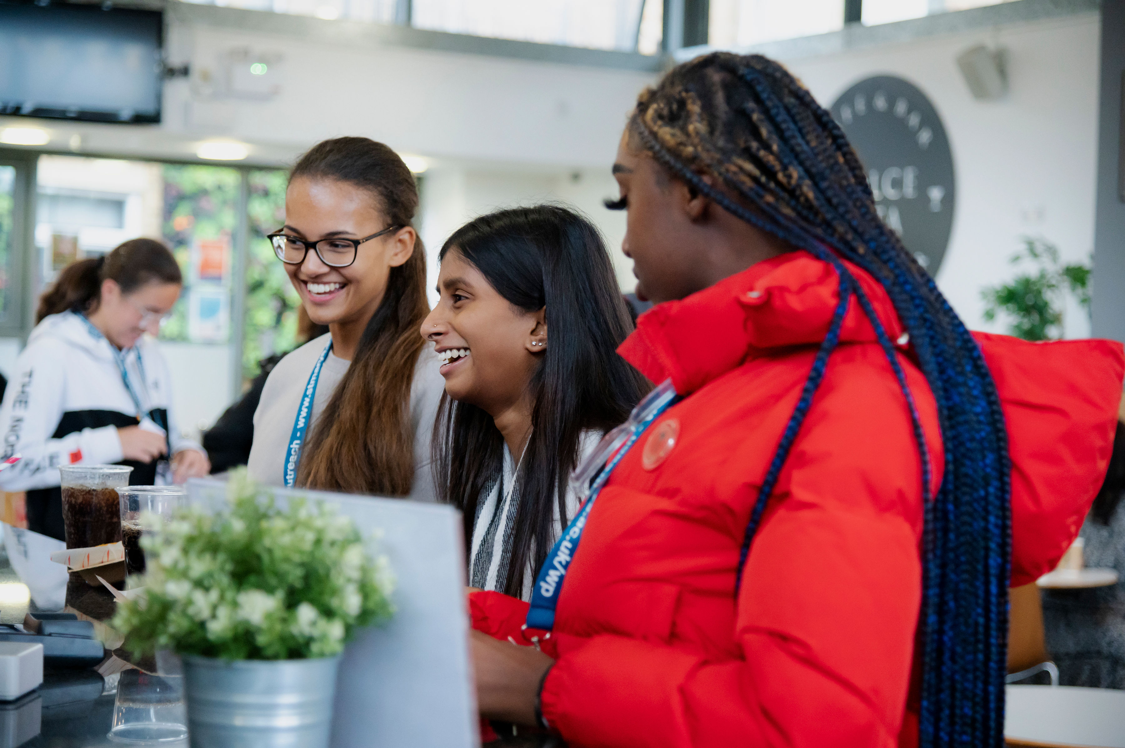 Three smiling students at St Mary's University