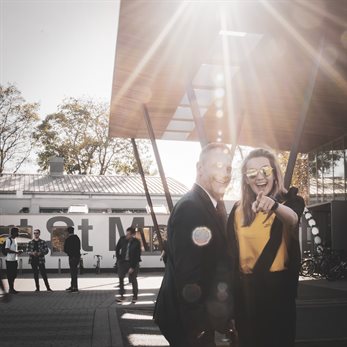 Happy student and lecturer posing for camera