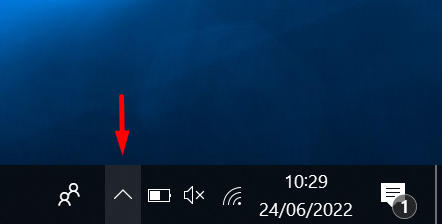 Shows an arrow pointing to the up arrow on the taskbar