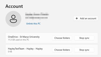 Screenshot showing the OneDrive account information and where to select stop sync