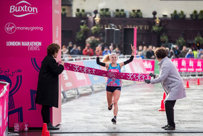 Charlie Purdue crossing finish line at athetlics event